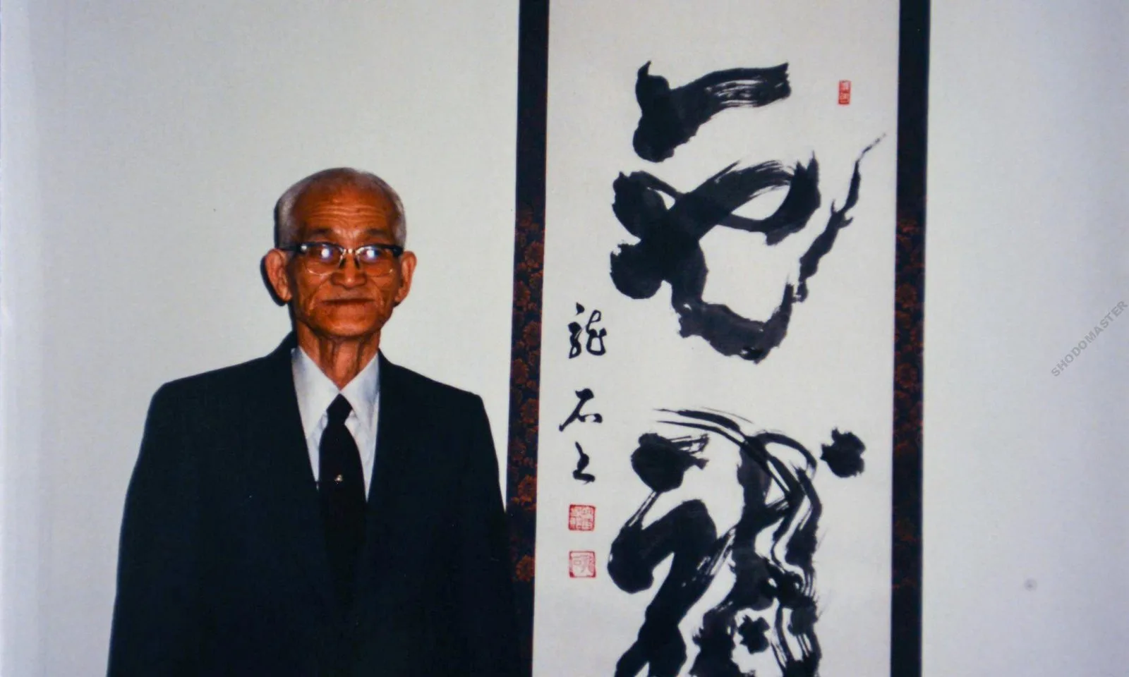 Ouchida Sensei poses with his signature character, Dragon